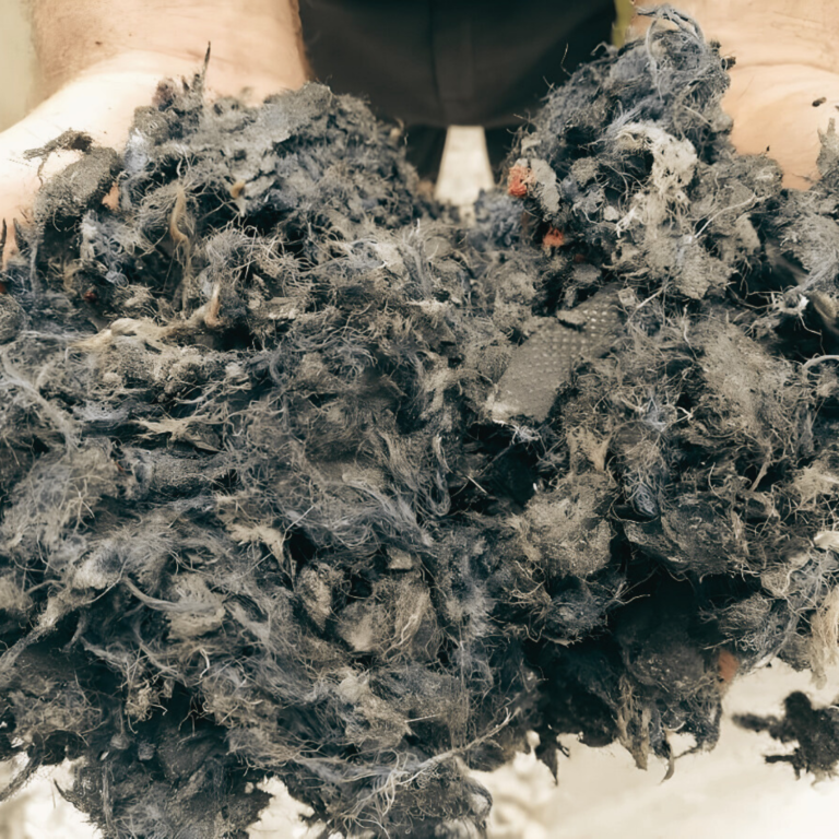 Close-up of Superior Fibre arena surface material showing processed fibre texture