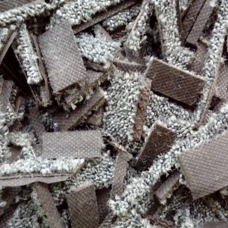 Close-up of carpet fibre offcuts used to create Equipro Riding Chip equestrian surface